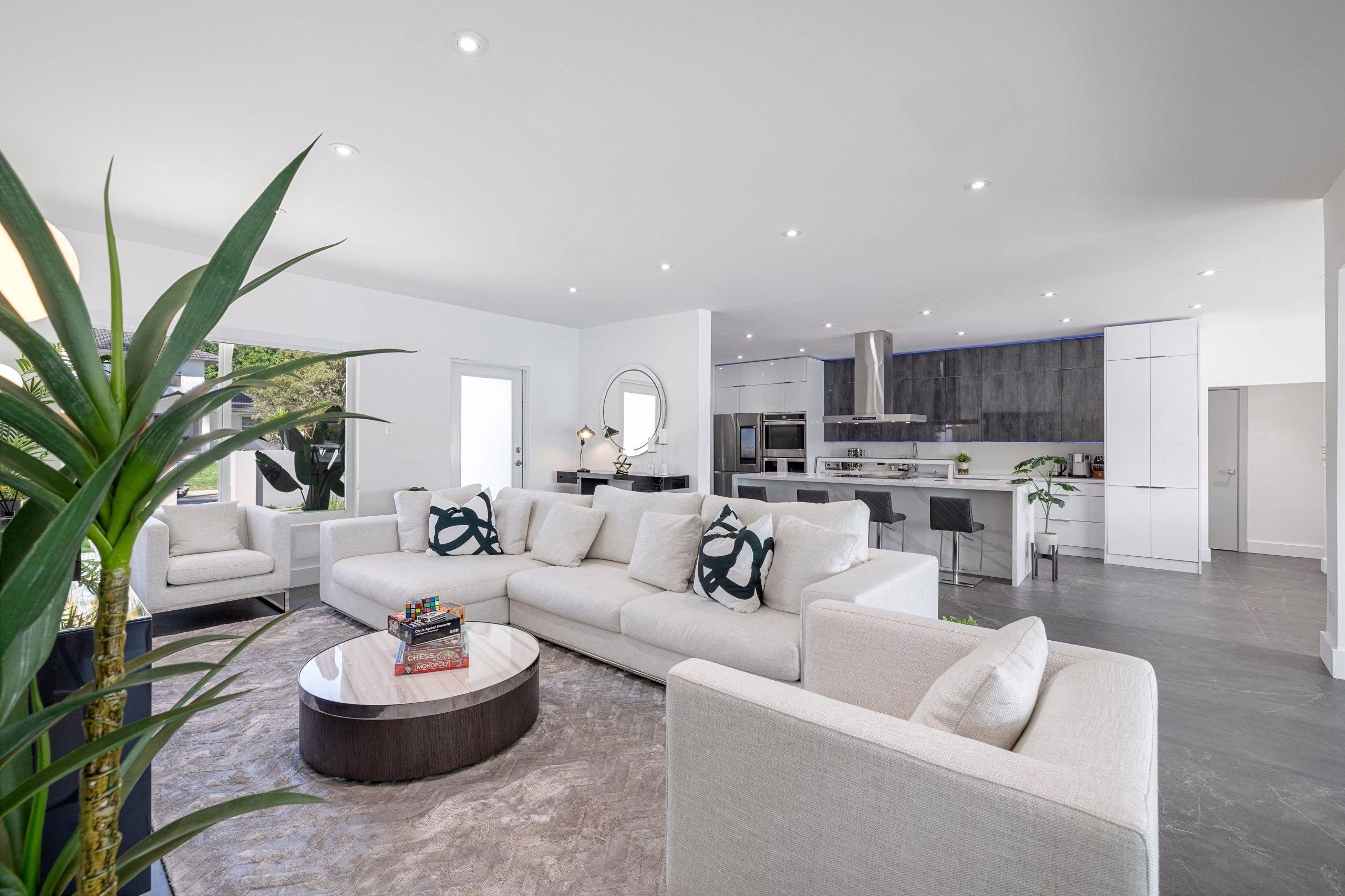 Open concept living space with natural light and airflow, demonstrating benefits of green building and sustainable home design in daily living
