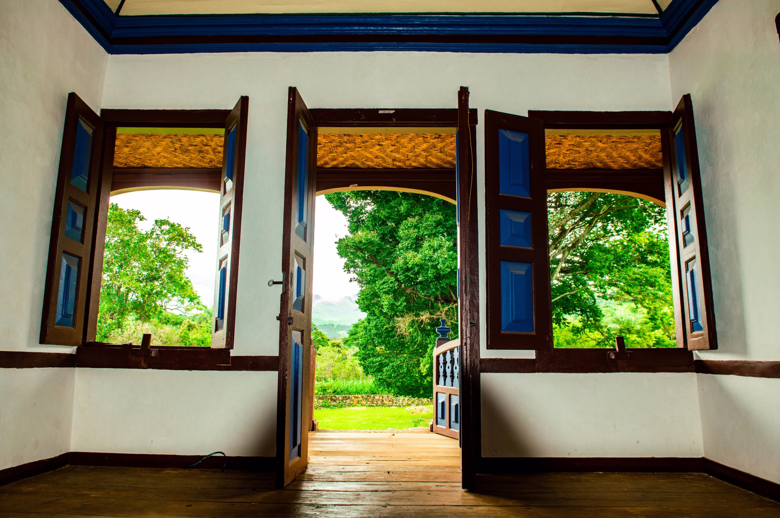 how to connect interior and exterior design with open windows framing outdoor landscape and creating natural visual connection