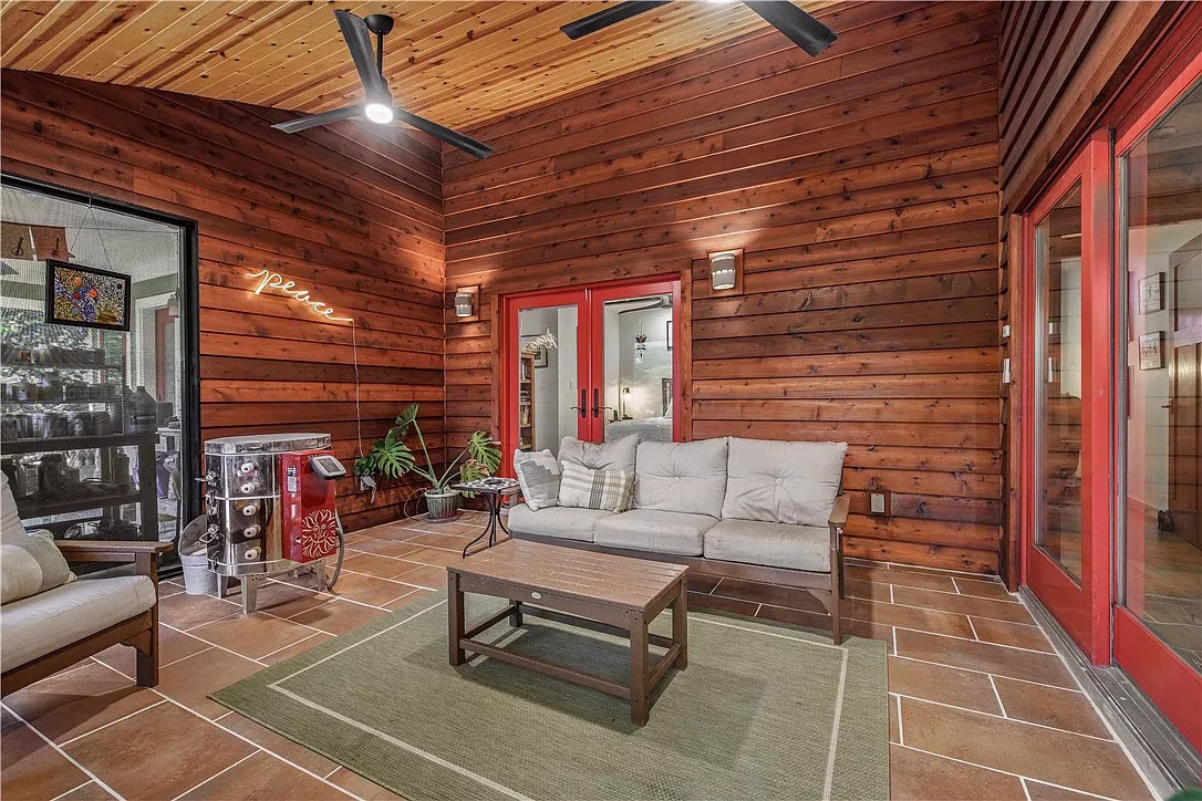 Covered wood patio with seating area designed for everyday living, showing how green building design principles support comfort and lifestyle