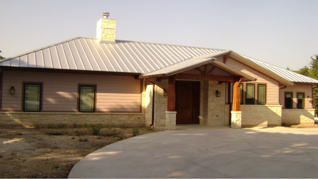 Large custom home with standing seam metal roofing highlighting benefits of metal roofing for energy efficient roofing and lifespan