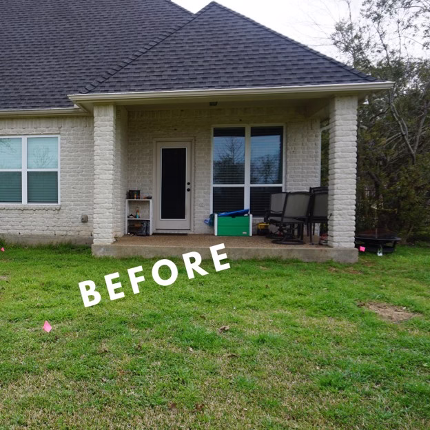 Existing backyard before an outdoor living addition in College Station showing the small covered patio and limited entertaining space.