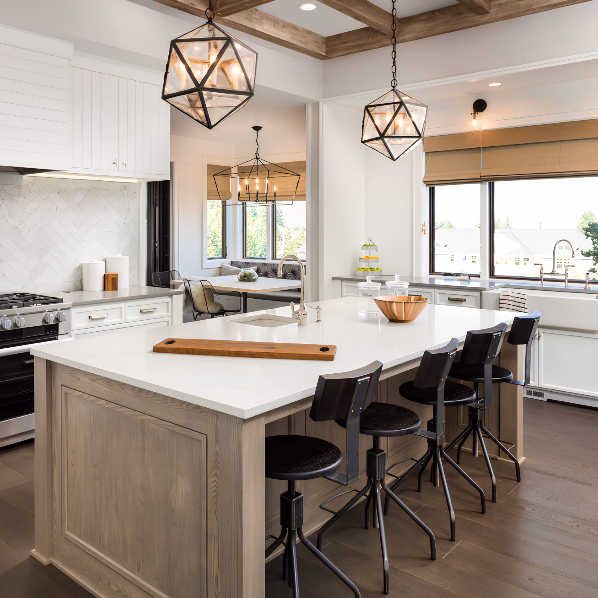 Kitchen with matching black geometric pendant lights, silver-toned faucets, and coordinating cabinet hardware.
