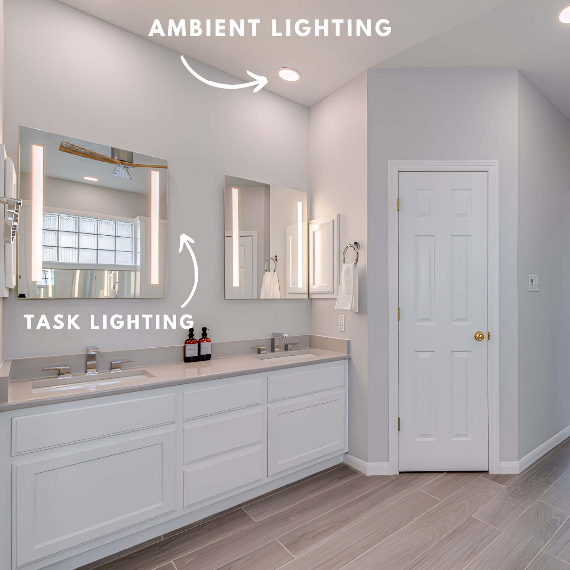 Double-sink bathroom vanity with recessed ceiling lighting and illuminated mirrors providing task lighting above each sink.