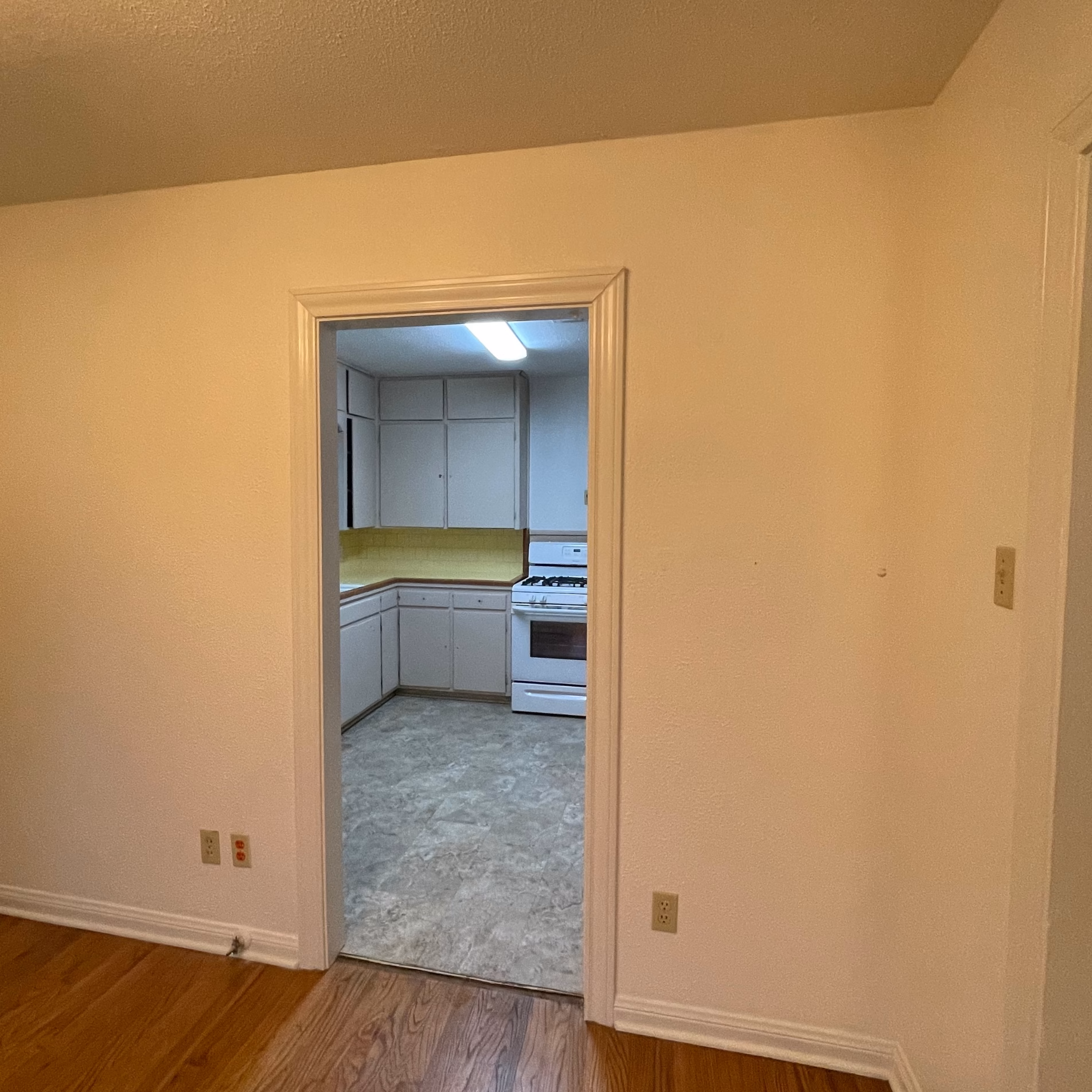 Original doorway separating the kitchen and dining room before the wall was opened during the Bryan home remodel.