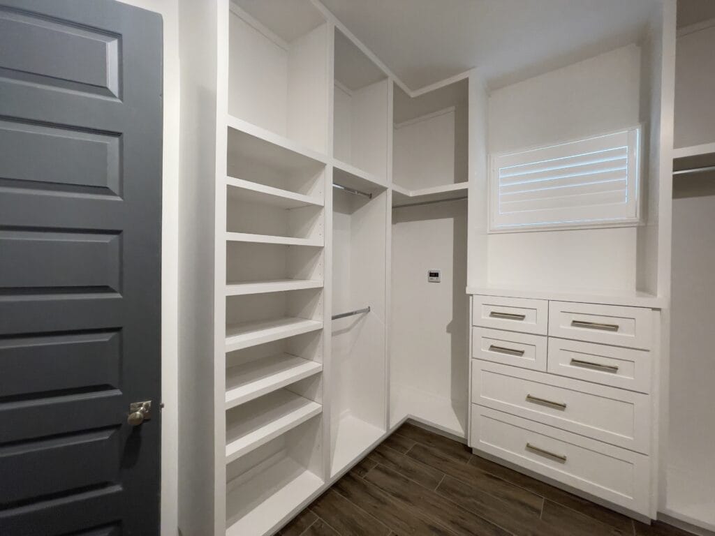 Closet remodel with islands and vertical shelving