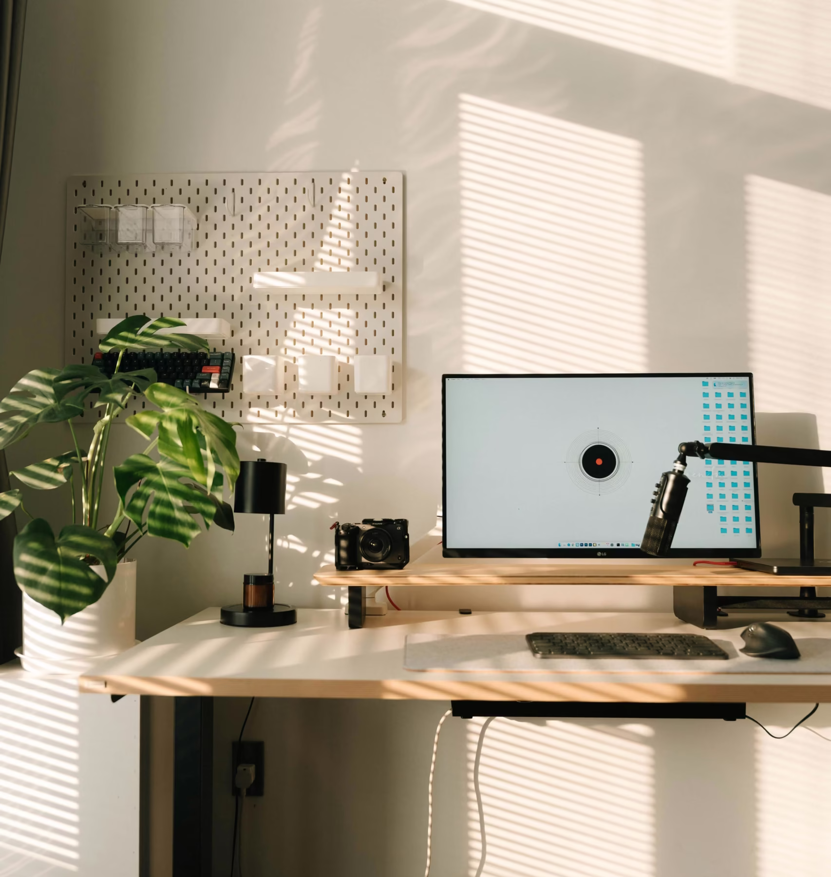 Home workspace with sunlight and plant shadows, showing how natural light affects mood at home during daily routines