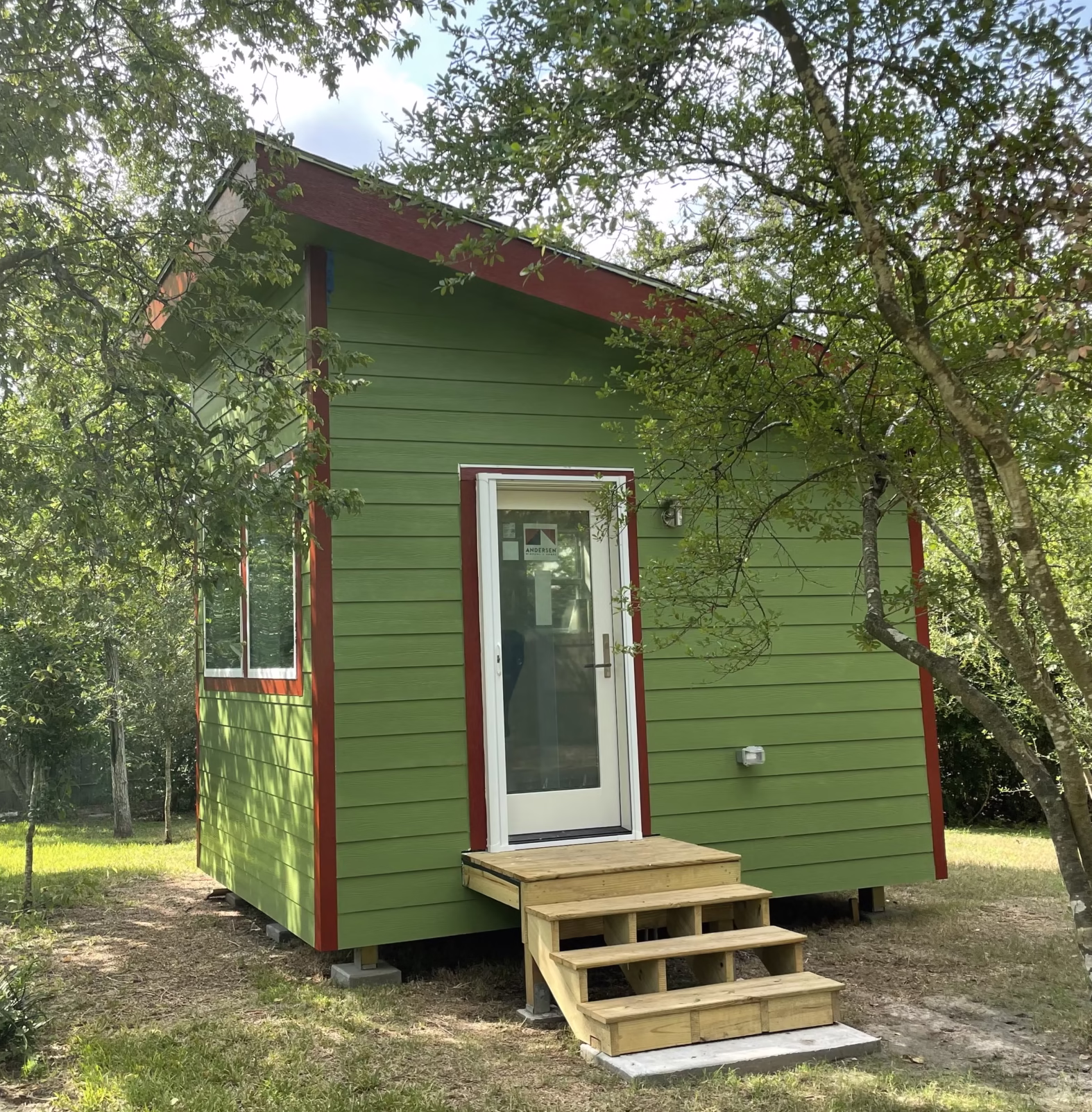 Compact standalone home addition with dedicated entry showing site placement and access planning.