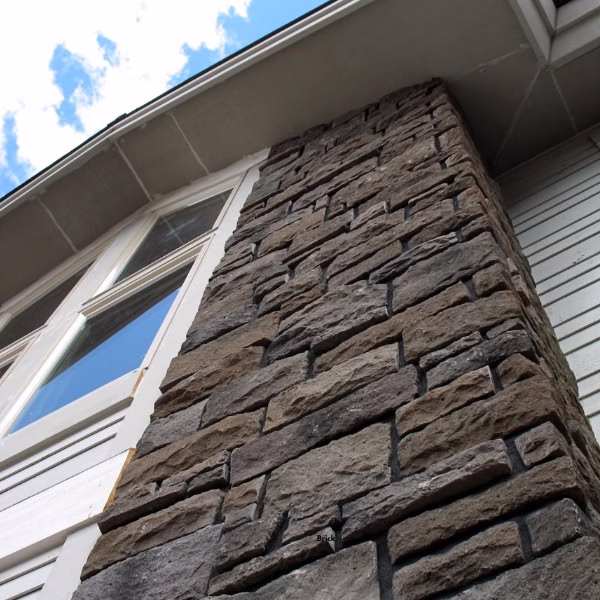 Close-up of exterior stone veneer column demonstrating masonry materials that contribute to thermal mass in hot humid climates.