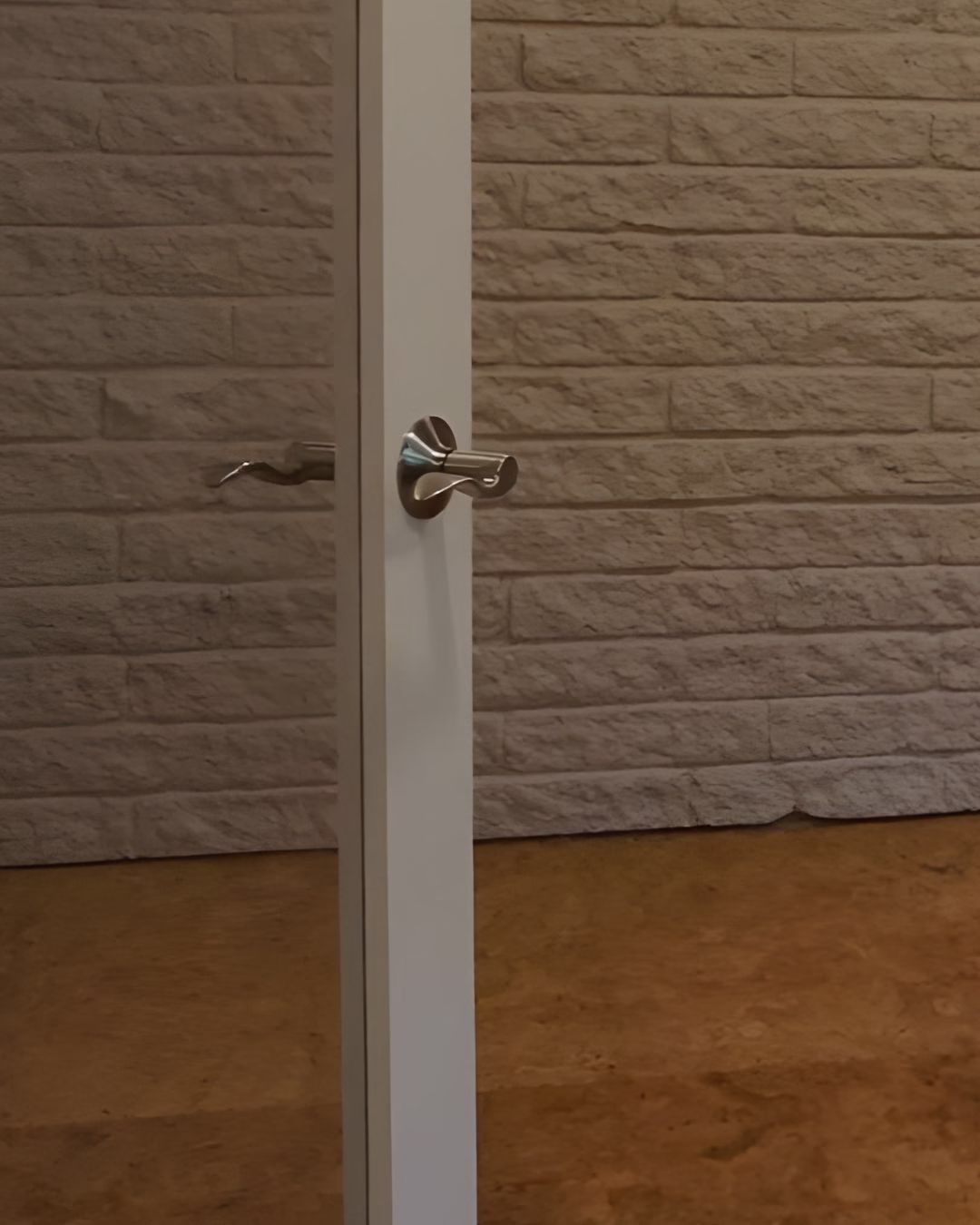 Lever-style door hardware installed during aging in place renovations for improved hand accessibility.