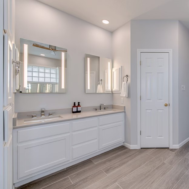 Double sink bathroom vanity with ample counter space and storage, reflecting thoughtful bathroom remodel planning for shared daily use