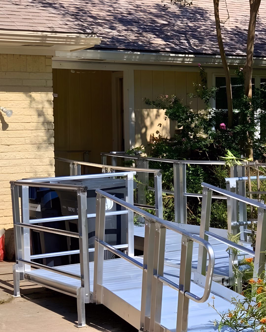 Exterior wheelchair ramp installed during an aging in place renovation in Bryan–College Station to improve safe home entry.