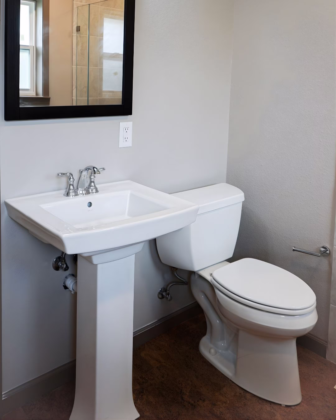 Pedestal sink installed during aging in place renovation to allow closer wheelchair access and improved usability.