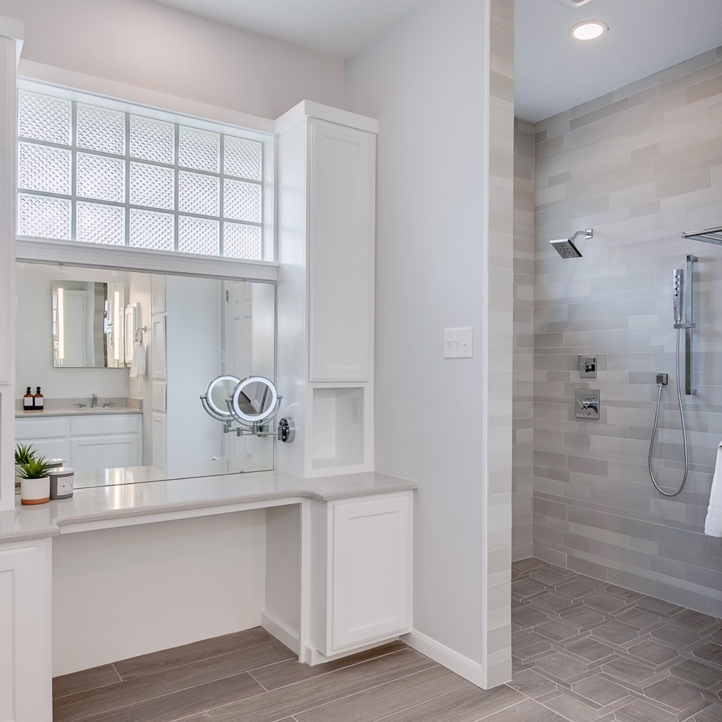 Bathroom remodel planning example showing a walk in shower placed behind a vanity wall to improve privacy and visual separation