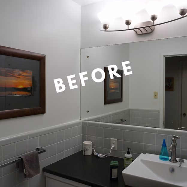 before vanity area from bathroom remodel College Station TX with dark countertop, large mirror, and original lighting fixture