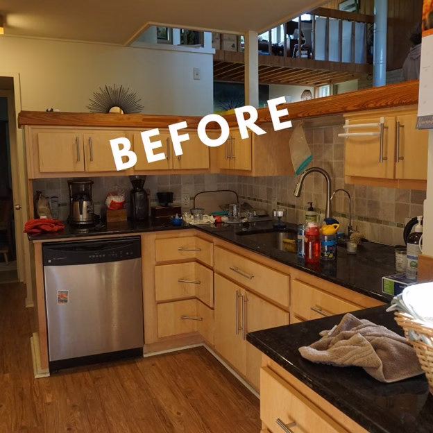 before kitchen layout from a mid century modern remodel College Station showing darker finishes, cluttered counters, and original sink and dishwasher area