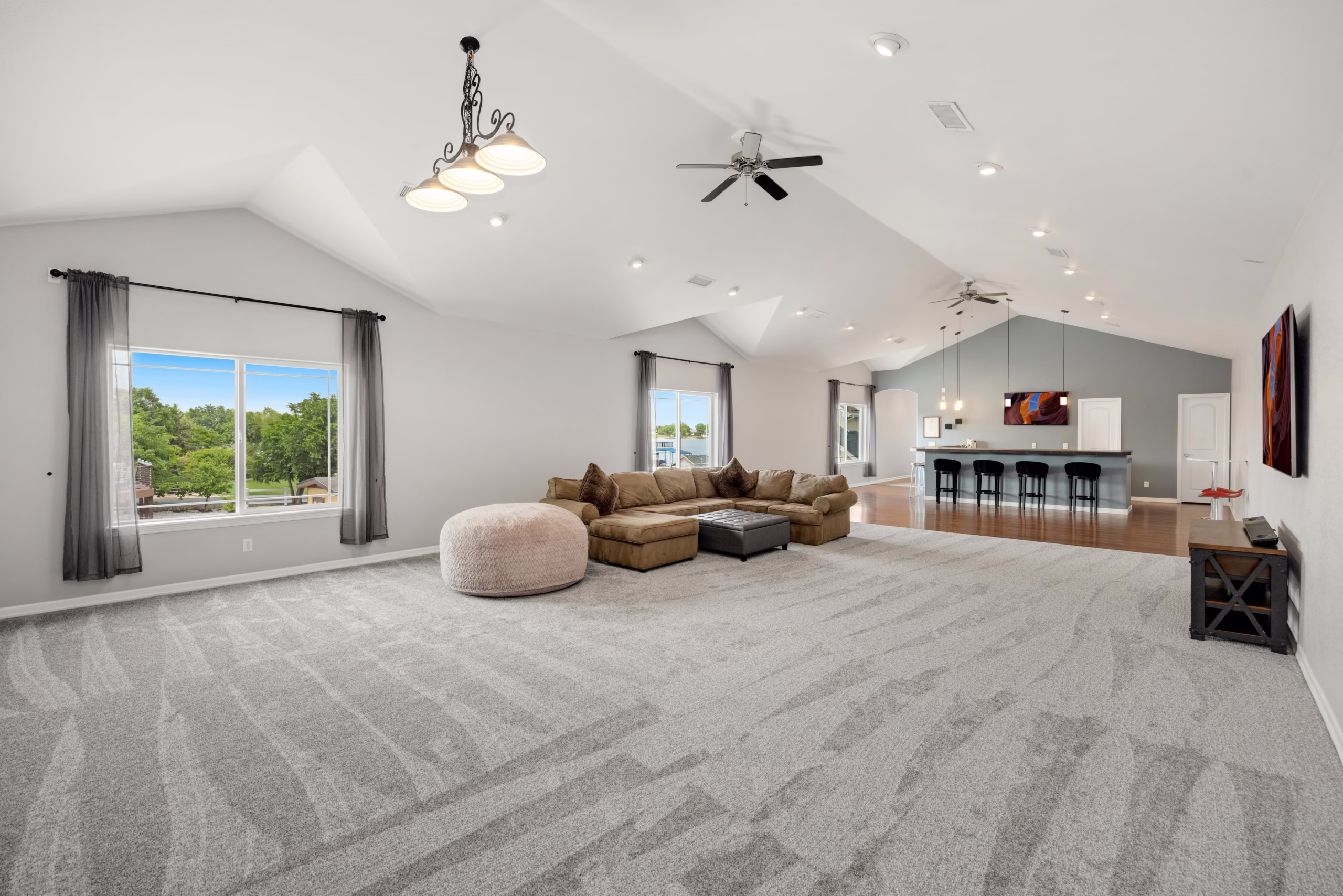 Large open living room with minimal furniture illustrating how oversized layouts can reduce comfort compared to tailored home design and functional home design