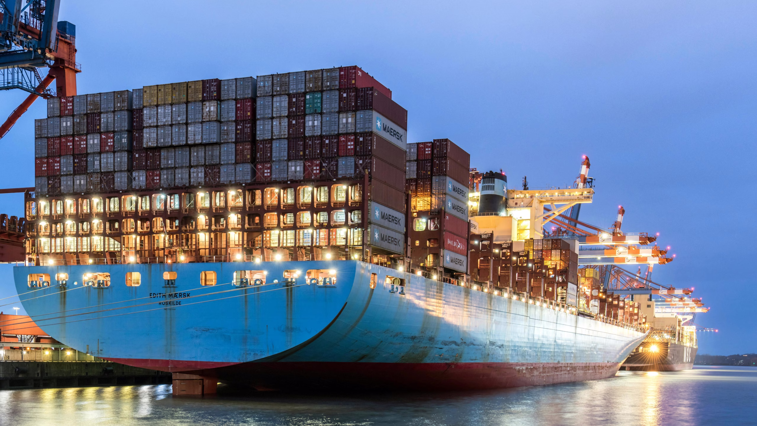cargo ship transporting materials across ocean illustrating hidden impacts in greenwashing in construction and eco-friendly home materials sourcing
