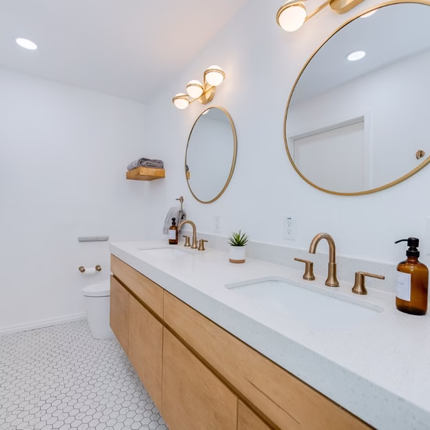 Bathroom Remodel Considerations double vanity with under-mount sinks and wall-mounted mirrors for easy cleaning and functionality