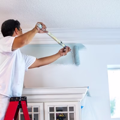 Interior painting services in a Bryan College Station home with careful ceiling and wall painting for a clean professional paint job and lasting finish