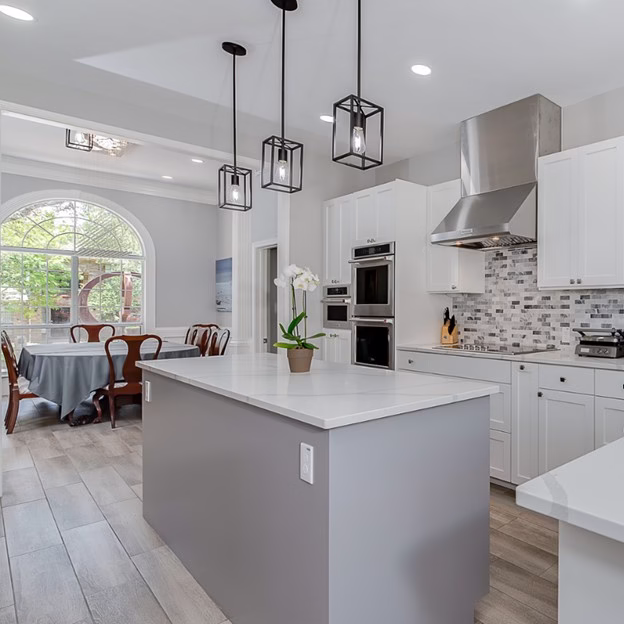 Whole home renovation kitchen transformation featuring custom cabinetry, large island, and modern finishes in this Southwood Valley home renovation