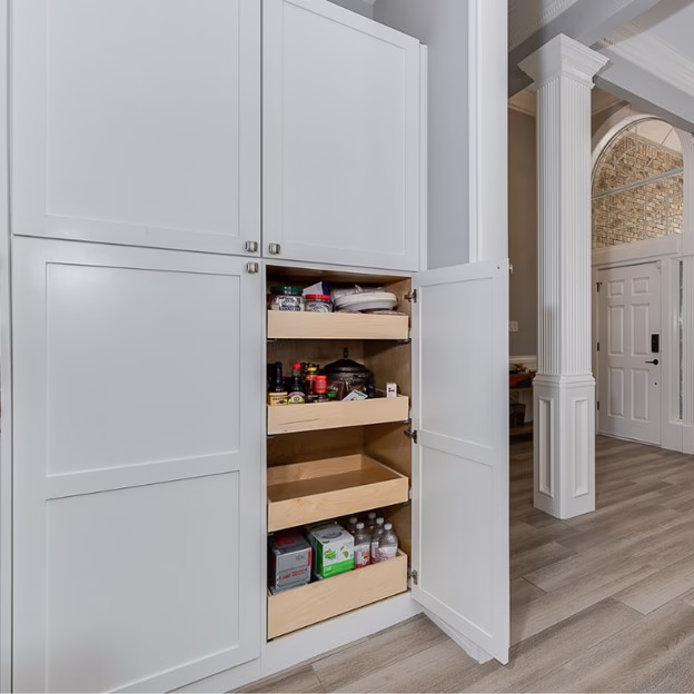 Floor-to-ceiling pantry pull-outs added during the whole home renovation to improve storage and replace the original pantry layout