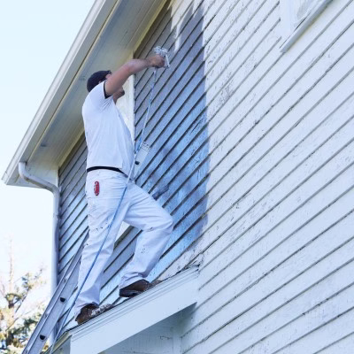 Professional house painting on exterior siding with proper preparation and coatings designed to improve durability and create a long lasting paint finish