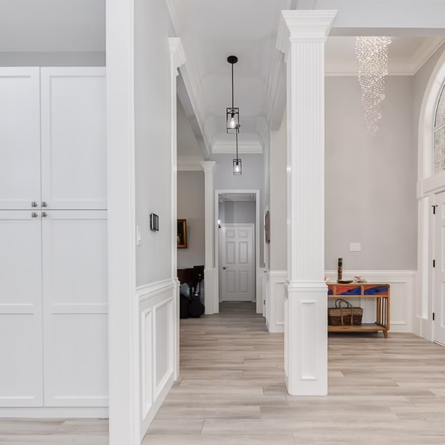 Updated hallway and entry sequence after the whole home renovation with brighter finishes, improved circulation, and cohesive modern detailing in this Southwood Valley home renovation