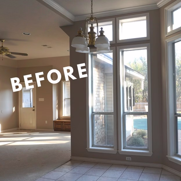 Before view of the breakfast area and living spaces with closed-off layout and darker tones before this whole home renovation College Station transformation