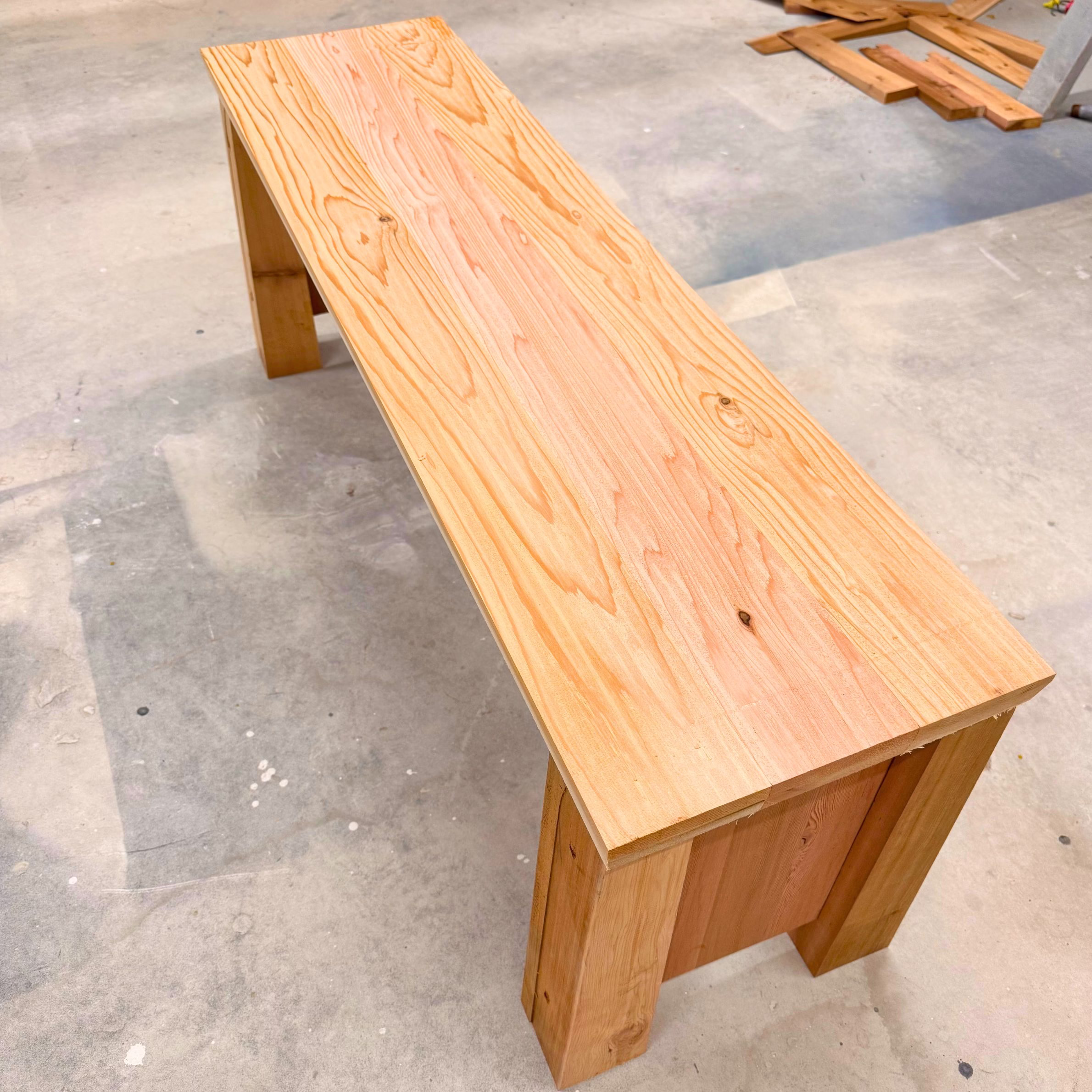 Finished custom cedar bench before installation at Aggieland Humane Society as part of a Bryan-College Station community partnership.