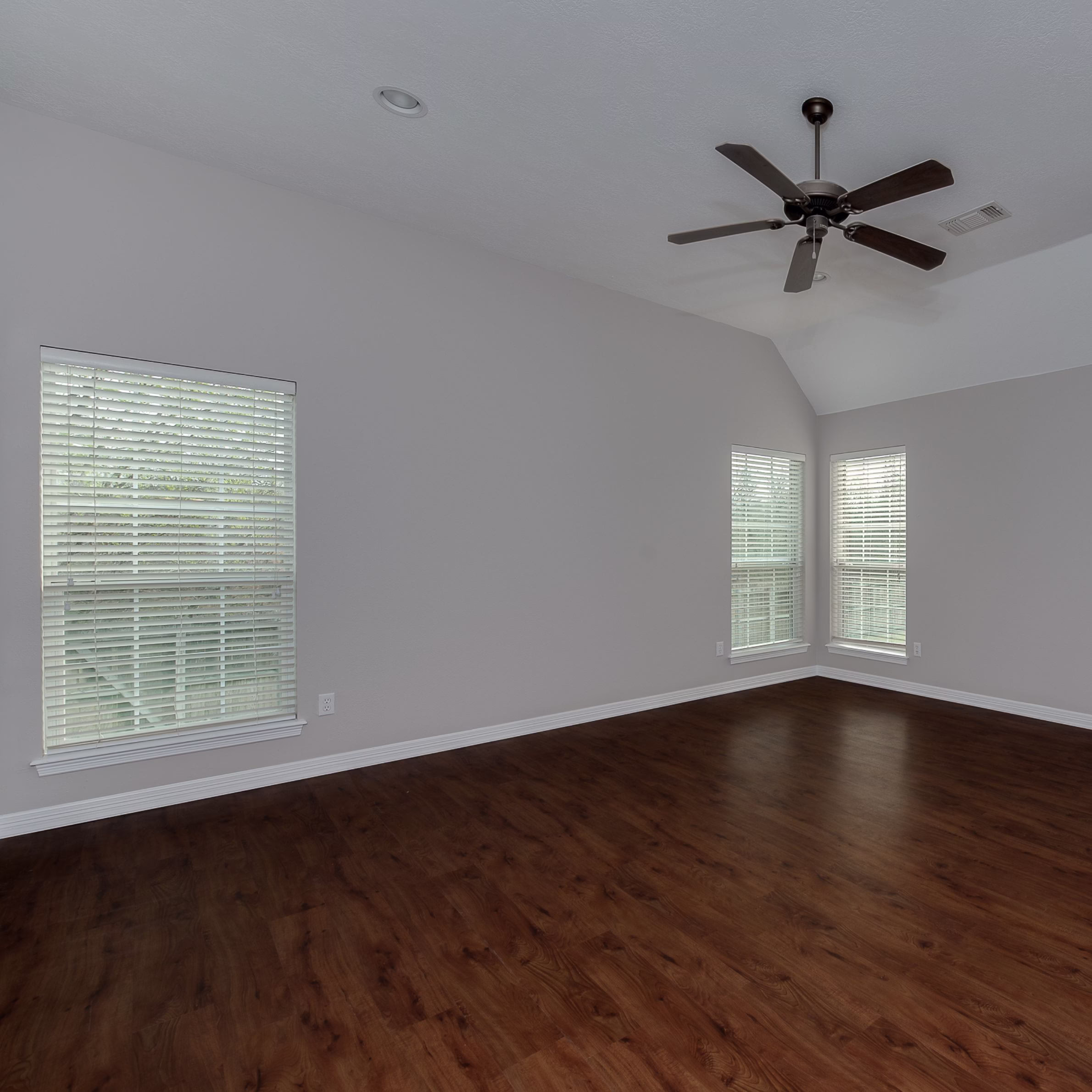Flex room refreshed with new paint and wood-look flooring during a modern home remodel, creating a bright, versatile space as part of this whole home remodel College Station project.