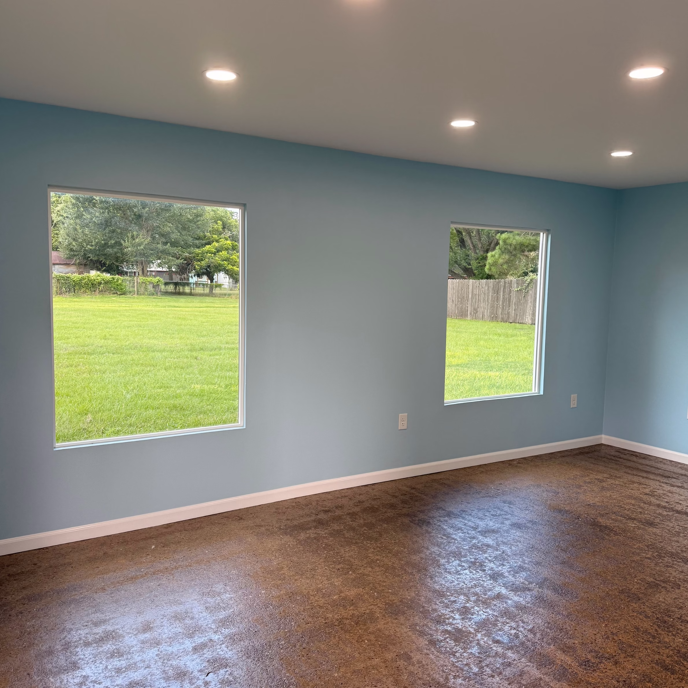 Updated living space with large windows, natural light, and custom remodeling details designed to improve everyday home value and comfort