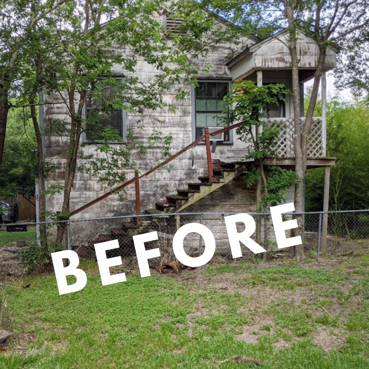 Exterior of an aging guest house with weathered siding, deteriorated stairs, and an elevated front porch before restoration