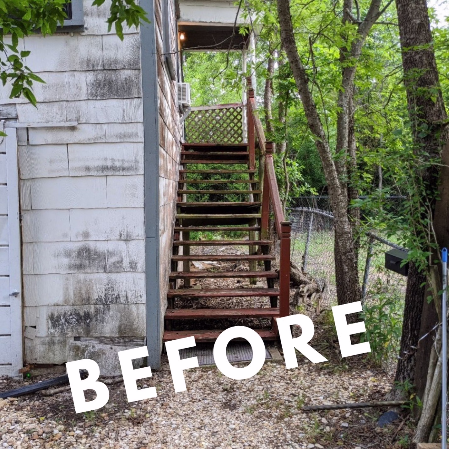 Deteriorated wooden staircase along the side of an older guest house before renovation in Bryan, Texas