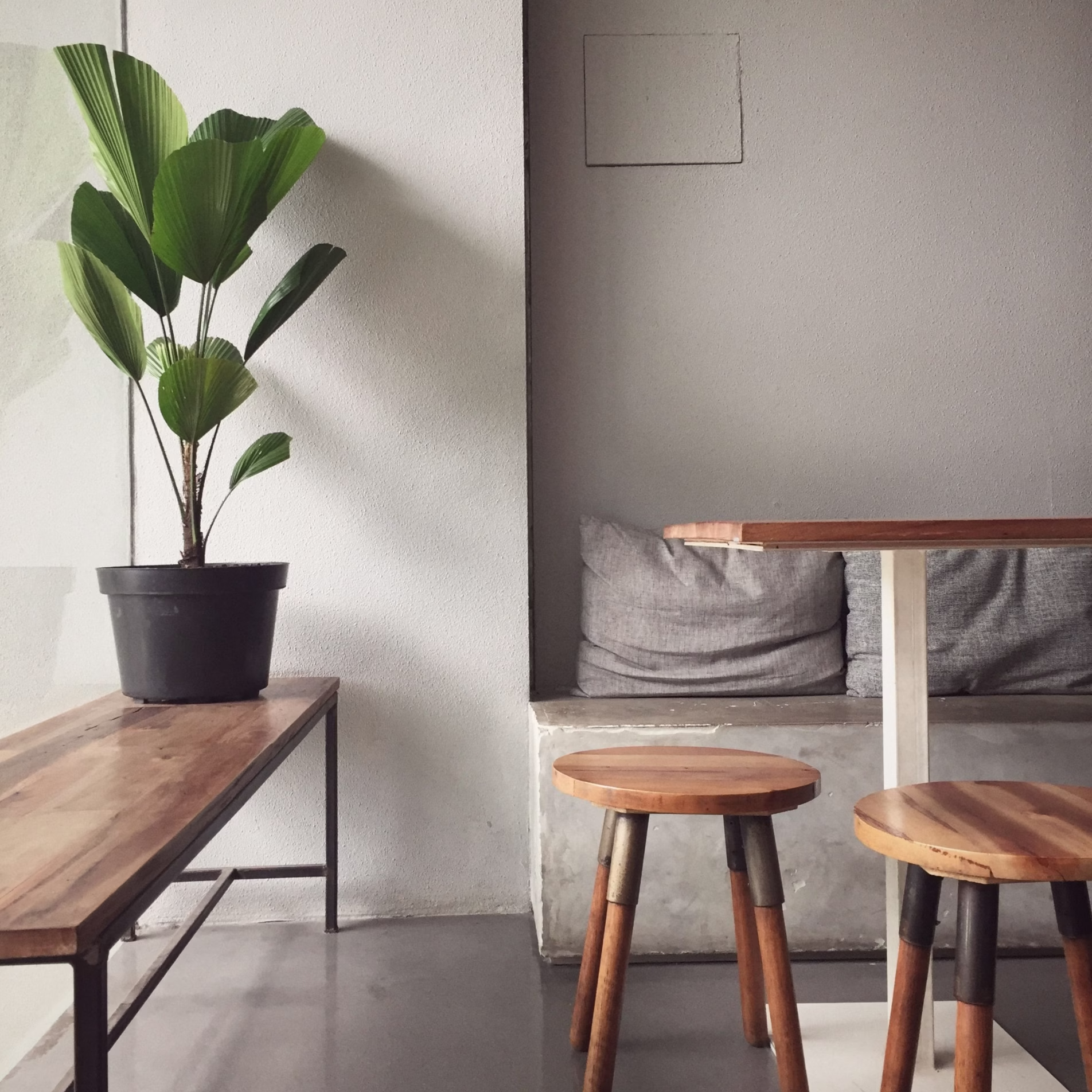 Interior built-in concrete bench showing how dense materials can be incorporated into functional home features.