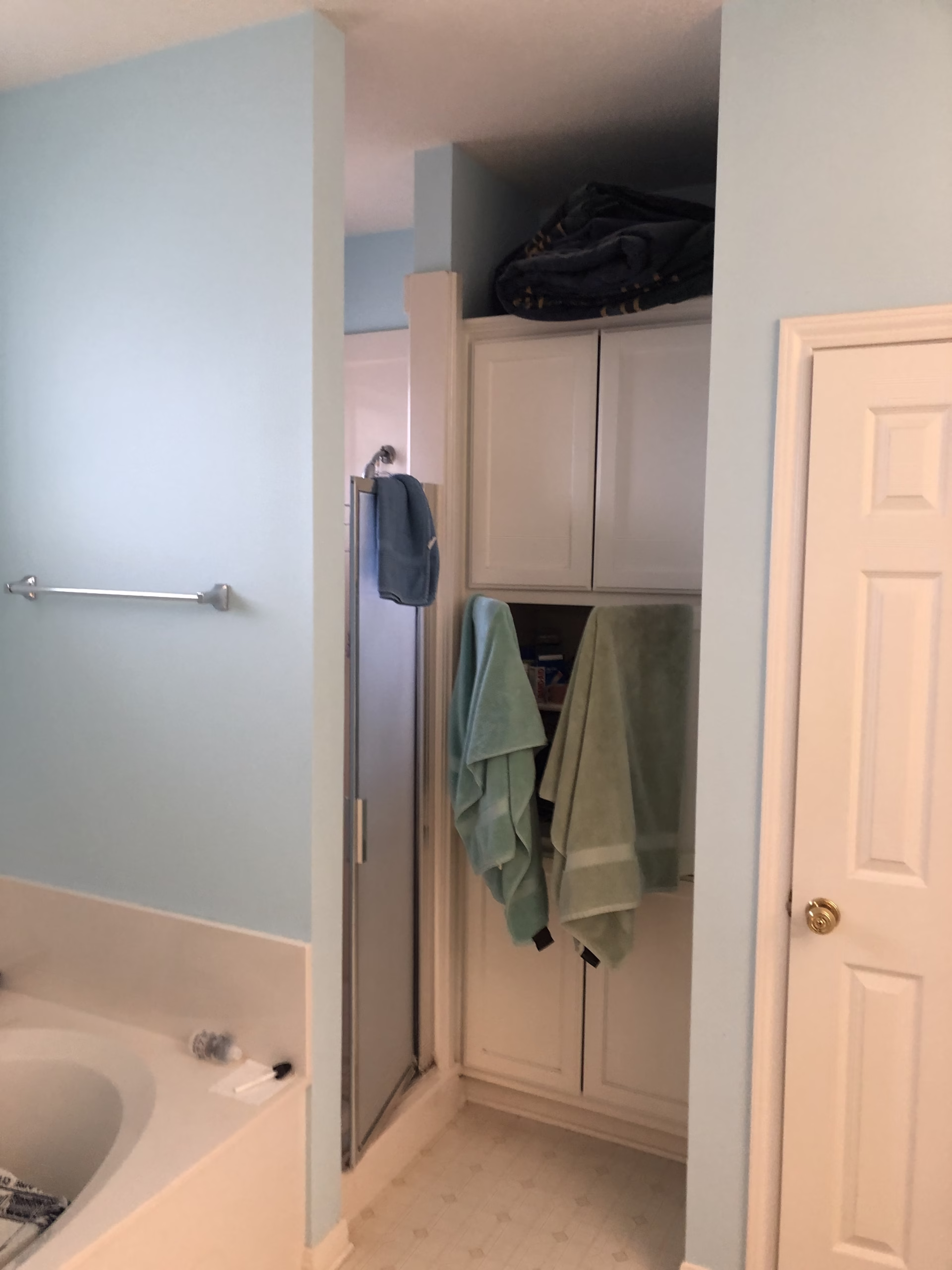 Original Shirewood bathroom layout showing the small enclosed shower, built-in cabinetry and edge of the garden tub.