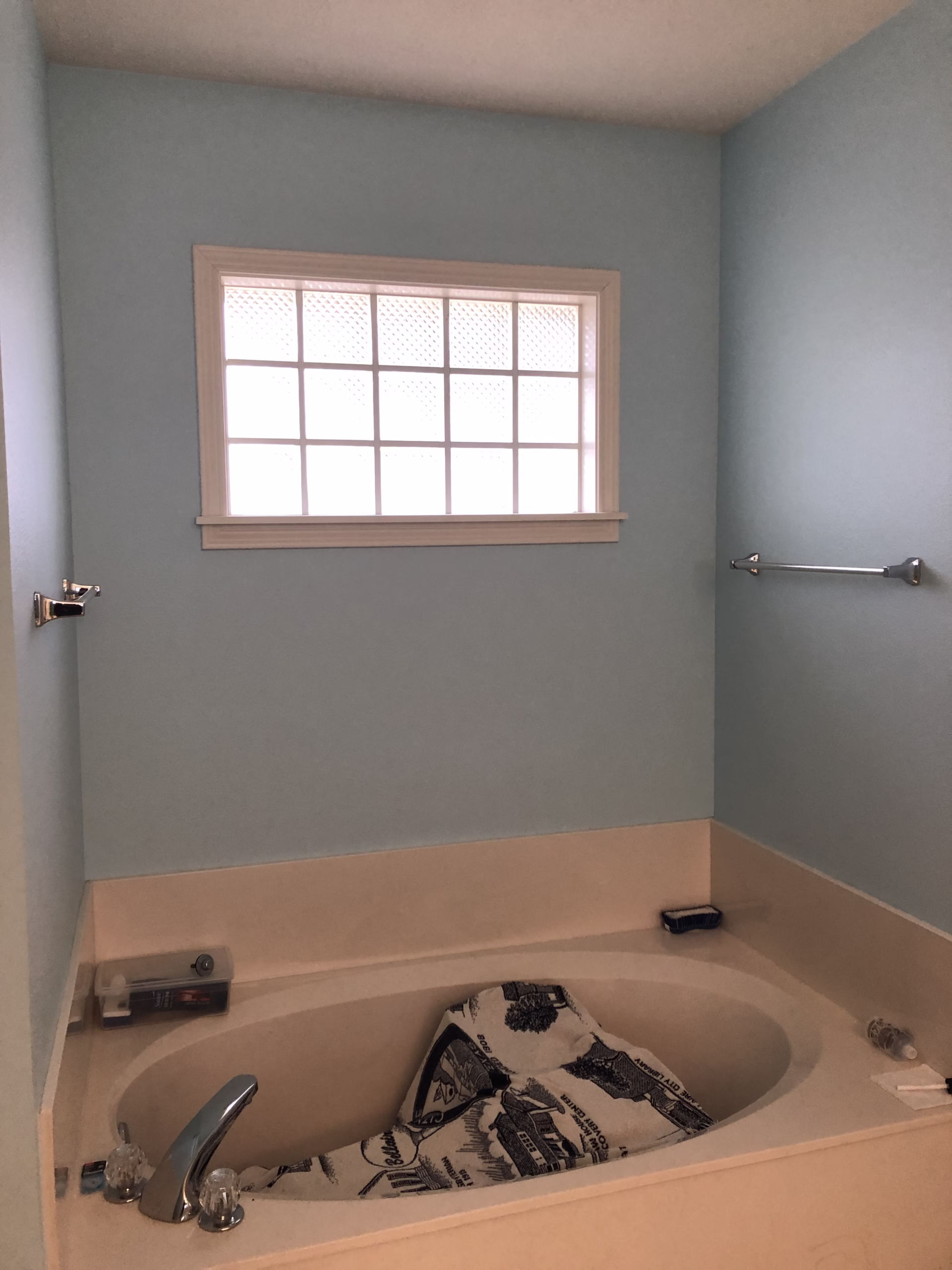 Before the Shirewood bathroom remodel, a large built-in garden tub occupied the space beneath the glass block window.